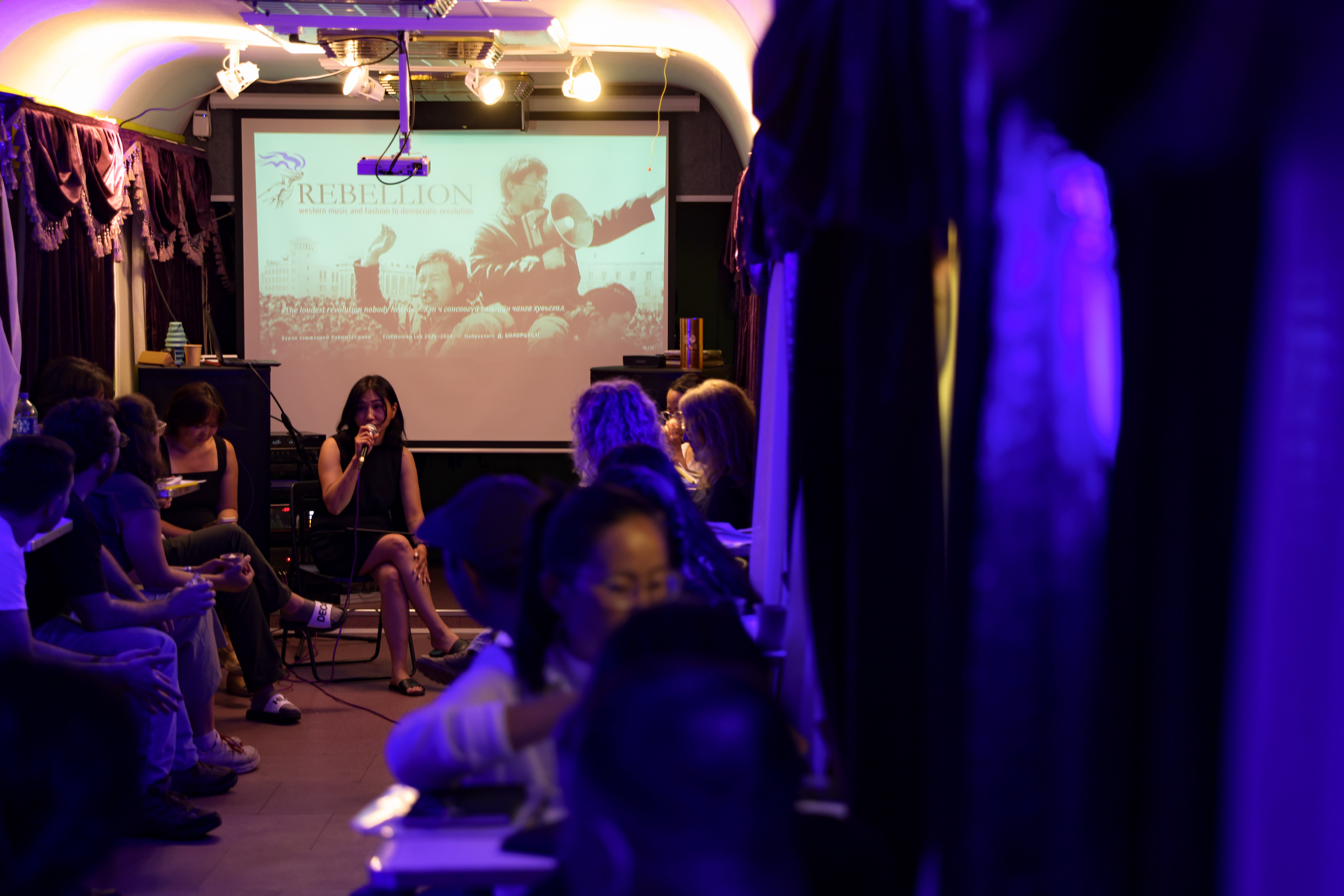 Filmmakers pitching on board the train carriage